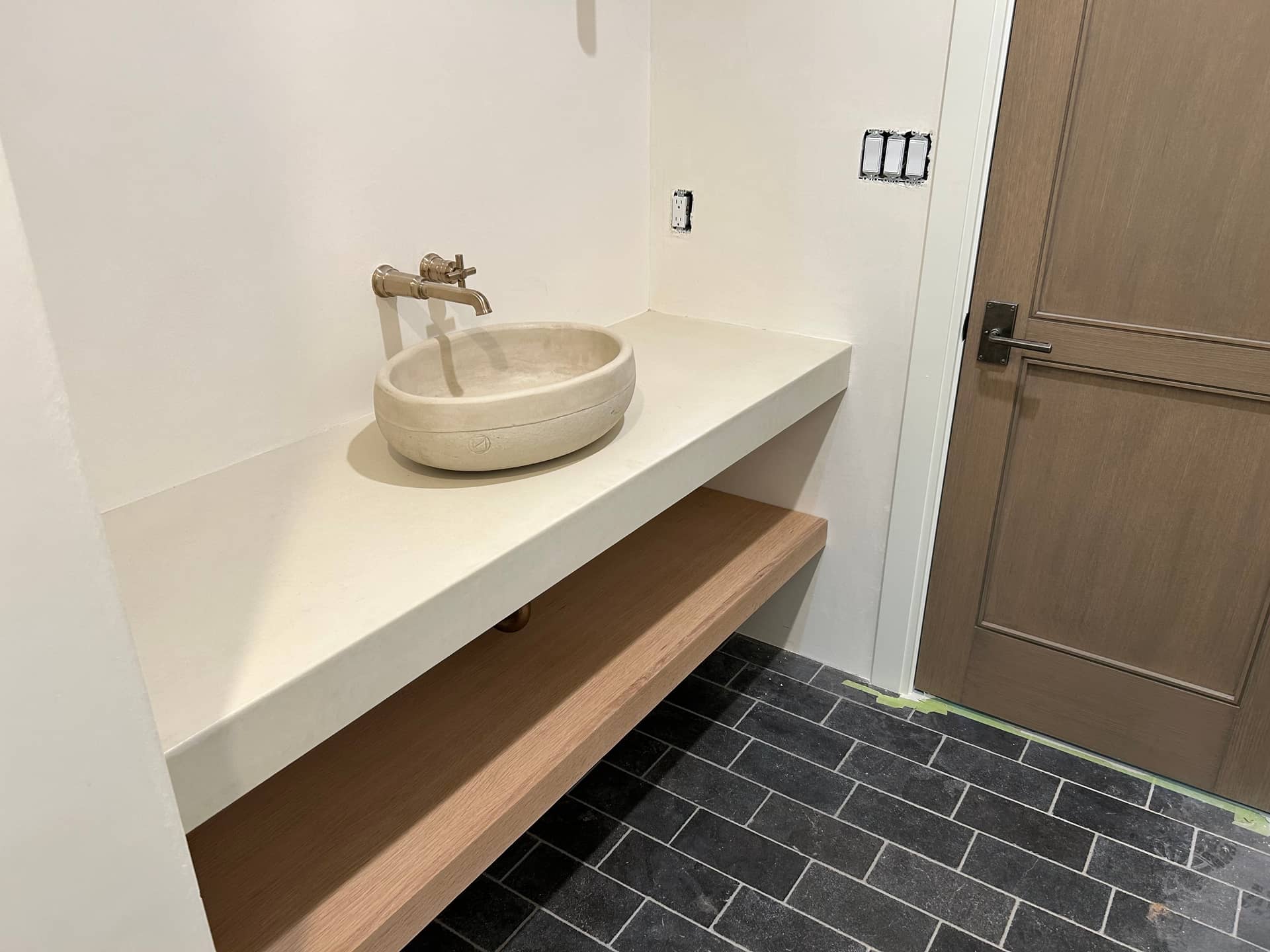 Custom precast concrete bathroom vanity with integrated sink